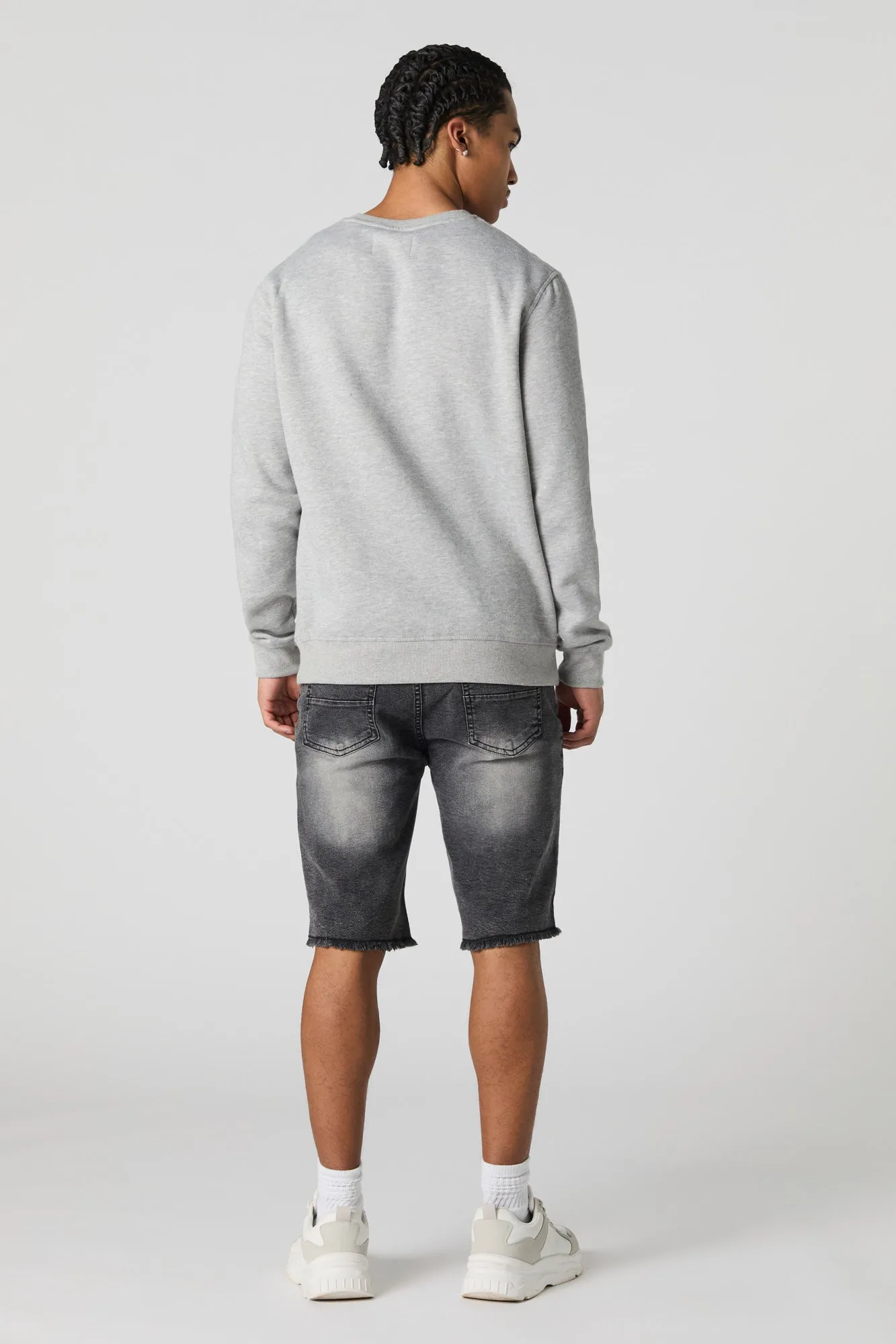 Short en denim d'aspect usé avec franges