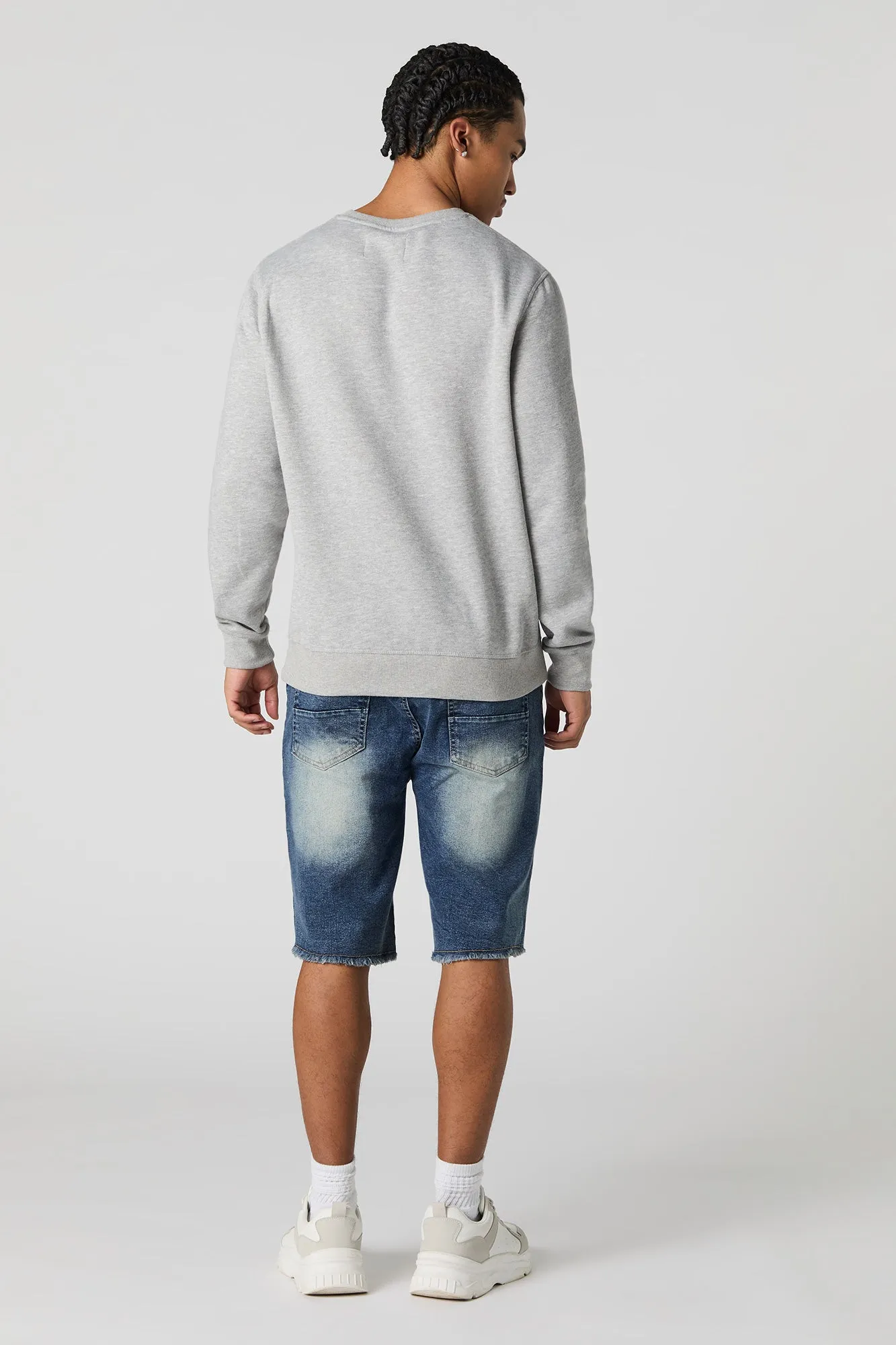 Short en denim d'aspect usé avec franges